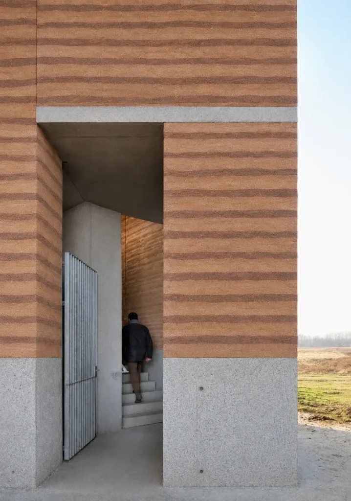 Earth-toned 3D-Printed Colored Texture applied to a modern building entrance with horizontal layered bands