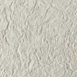 Ivory Cream Chiseled Stone Texture close-up with warm light mineral tone and natural chiseled surface relief
