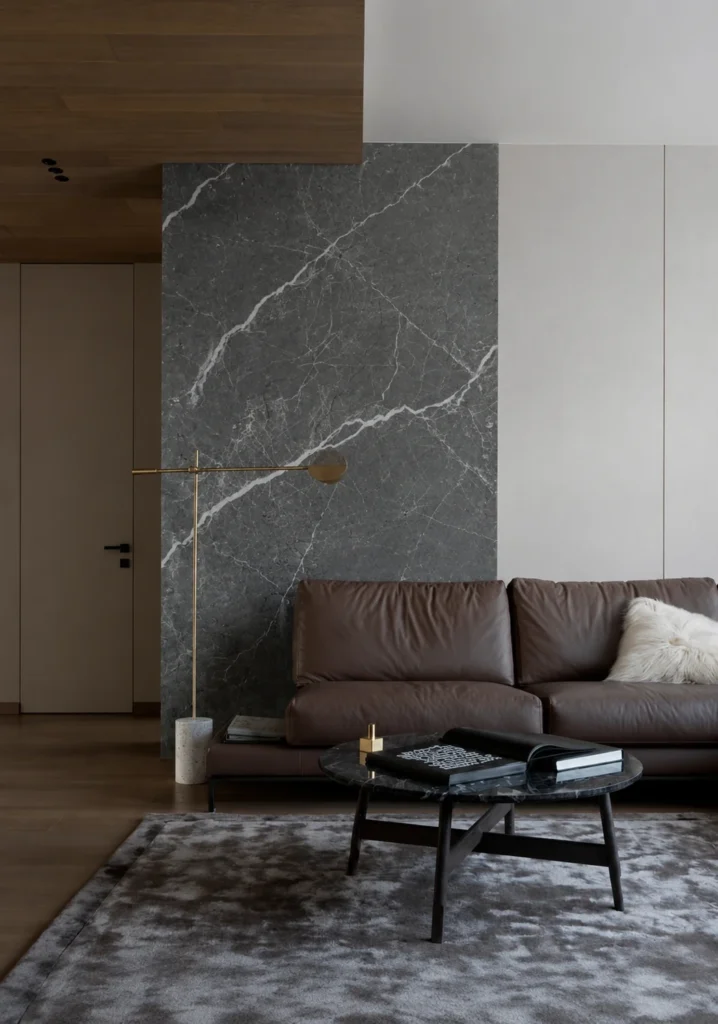 Graphite Vein Sintered Stone Texture feature wall with white mineral veining in a modern living room