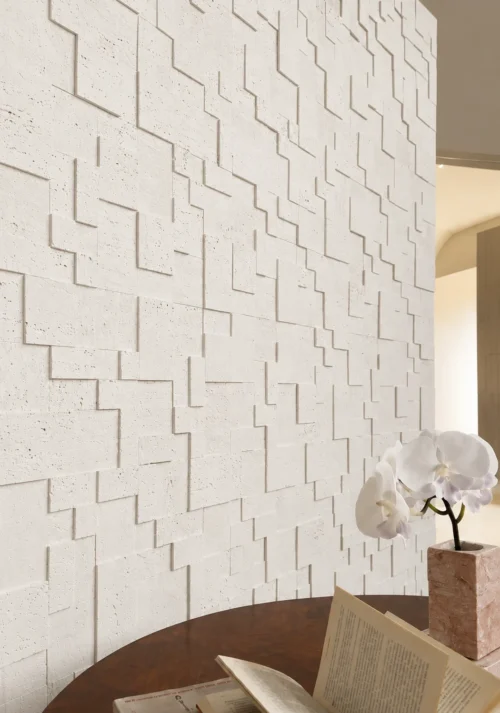 Patterned Travertine Interior Feature Wall | YITA Patterned Travertine feature wall with geometric stone pattern in a warm minimalist interior