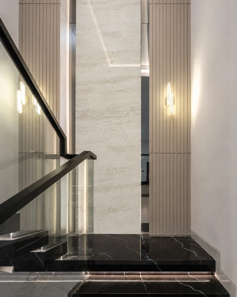 Pearl Ivory Marble Texture feature wall in a modern stairwell with soft ivory tones and subtle stone movement