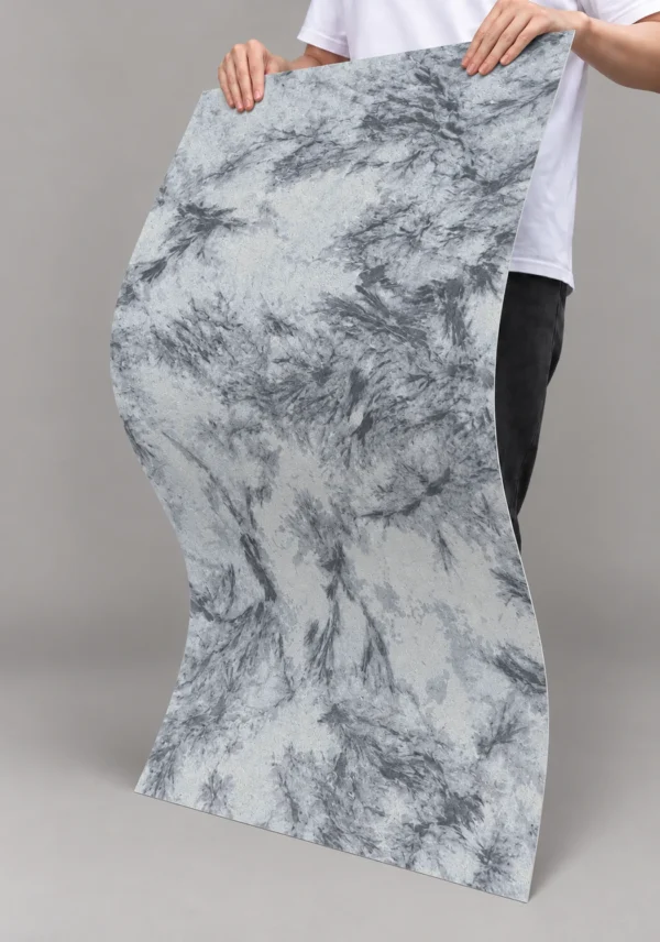 Silver Bloom Flexible Marble Texture Detail | YITA Silver Bloom Marble Texture flexible sheet bent to show flowing gray mineral pattern and thin curved form