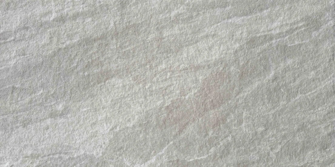 Silver Mist Granite Texture close-up with soft gray-white mineral movement and fine granular surface