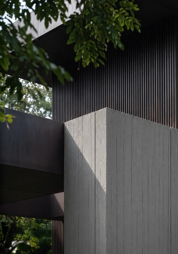Cast Wood Grain flexible stone cladding on a modern exterior wall with vertical board formed texture