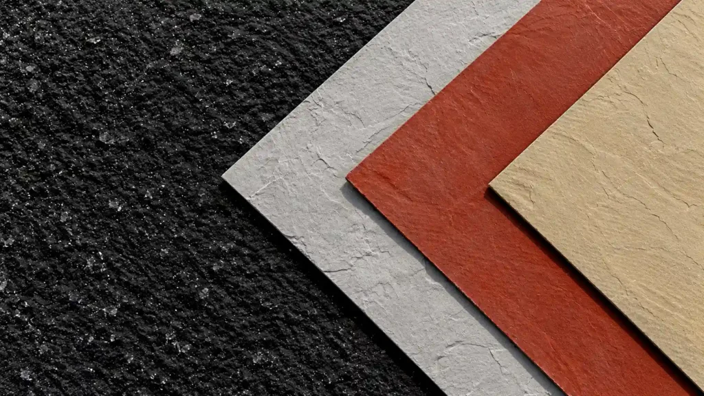 Three flexible stone panels in different colors layered to show their thin edges