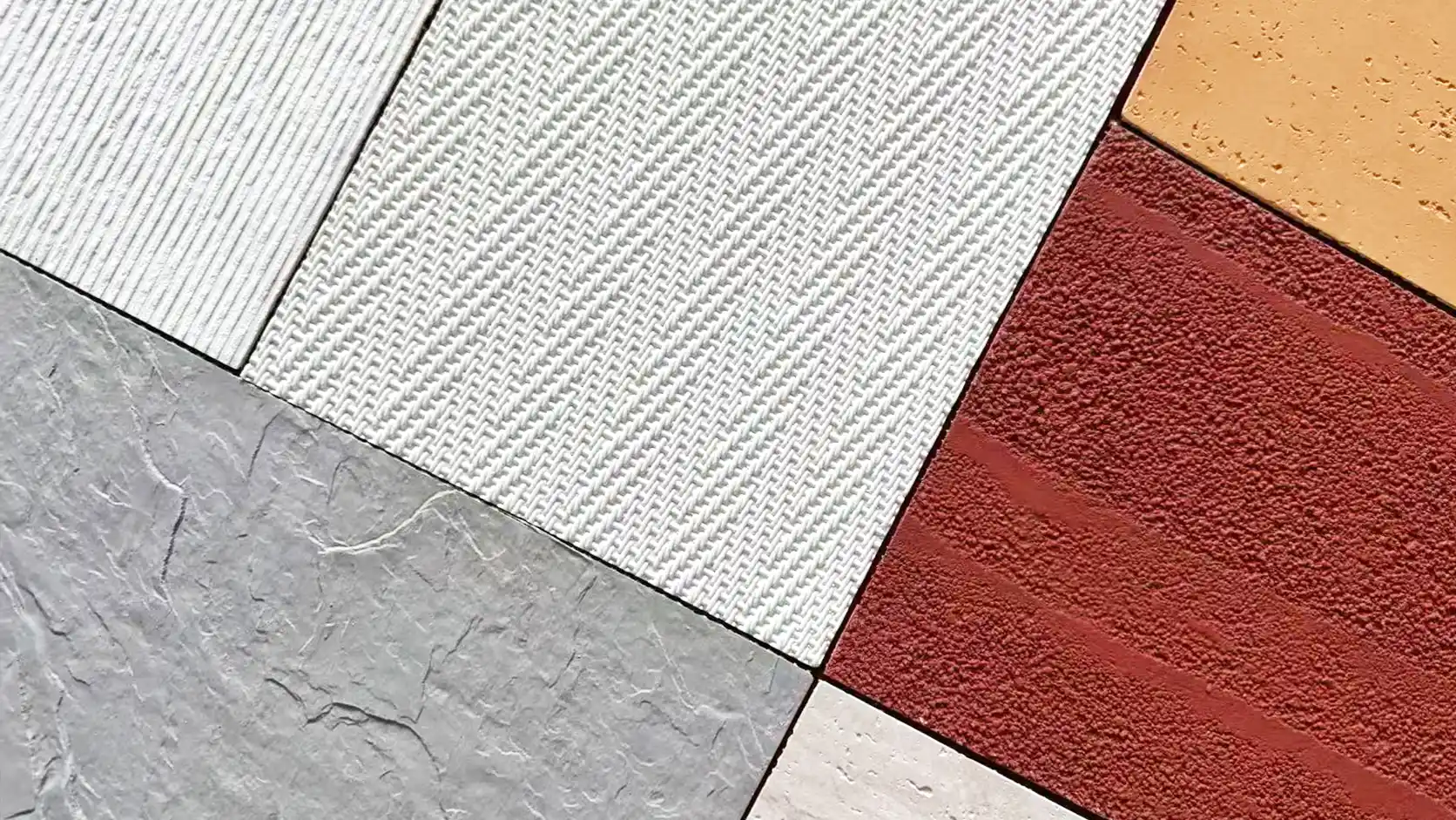 Assorted flexible stone sheet samples with linear, woven, stone and textured finishes