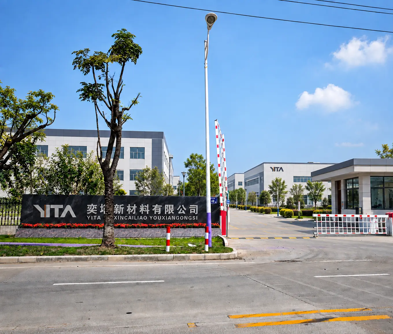 YITA company entrance with landscaped industrial buildings and main gate