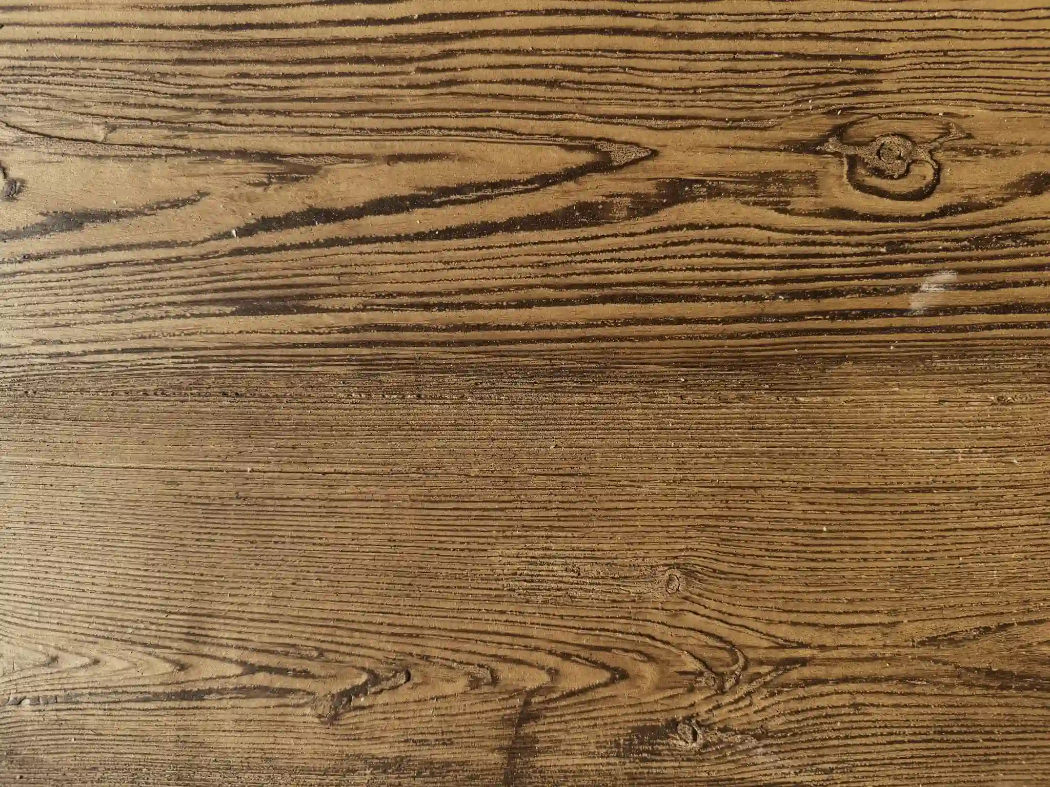 Golden natural wood grain flexible stone with dark flowing timber lines and visible knot detail