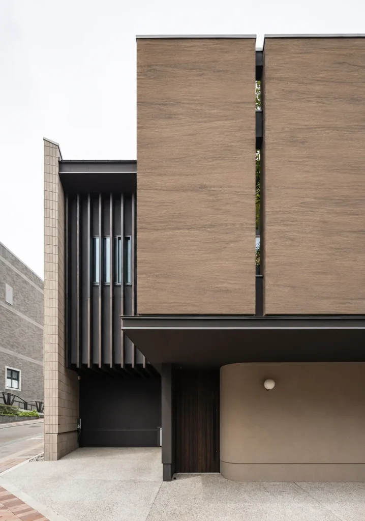 Honey oak wood grain flexible stone panels applied to a modern building exterior facade