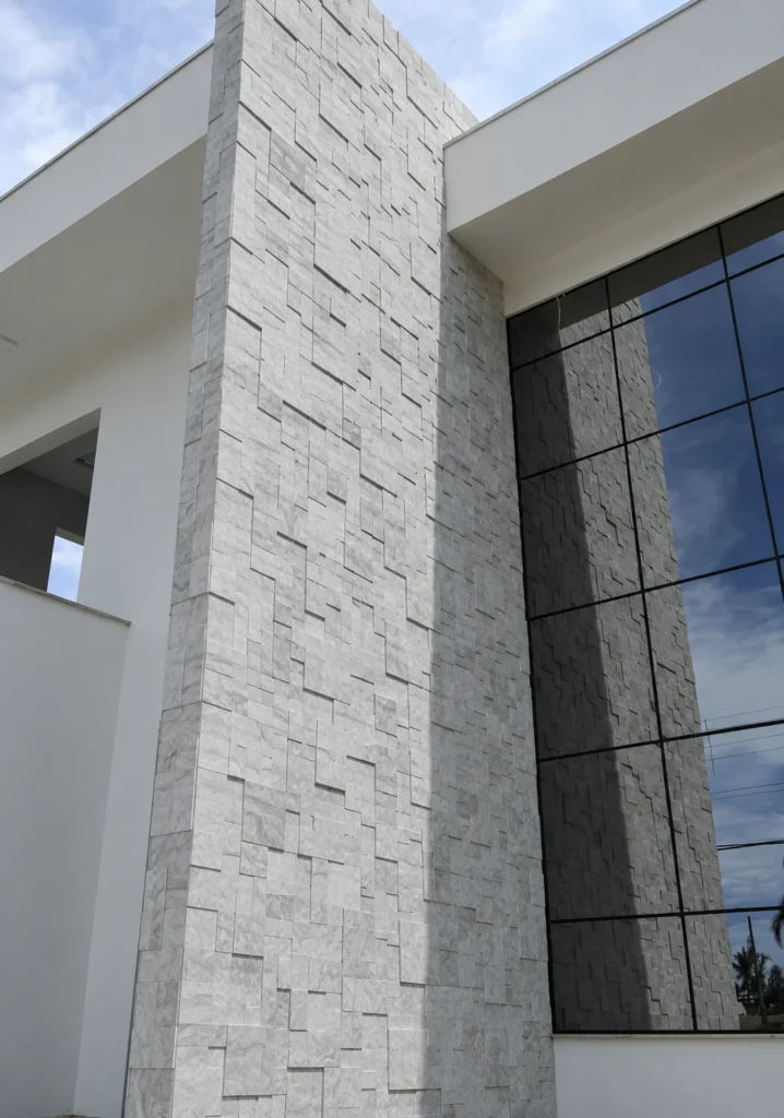 Patterned Travertine wall cladding on a modern exterior facade