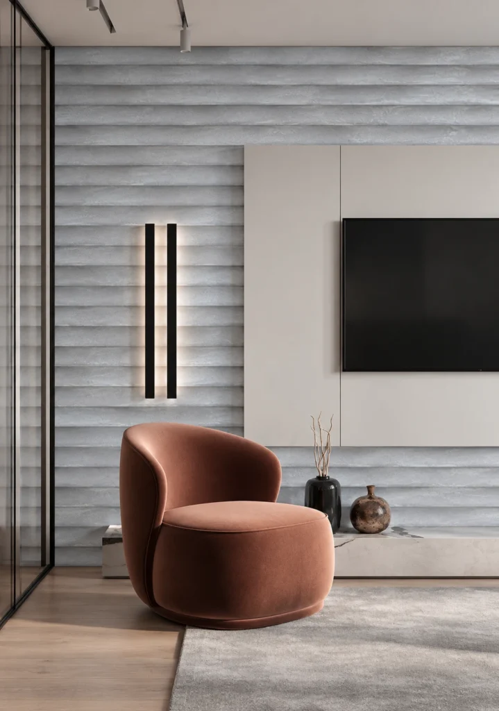 Light gray layered feature wall in a modern living room with a terracotta lounge chair