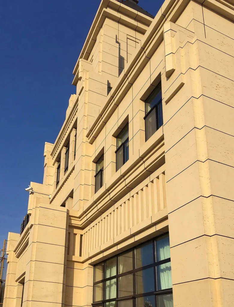 Full elevation view of Xinghai No.1 building in Hami Xinjiang, exterior facade clad with travertine MCM flexible stone veneer