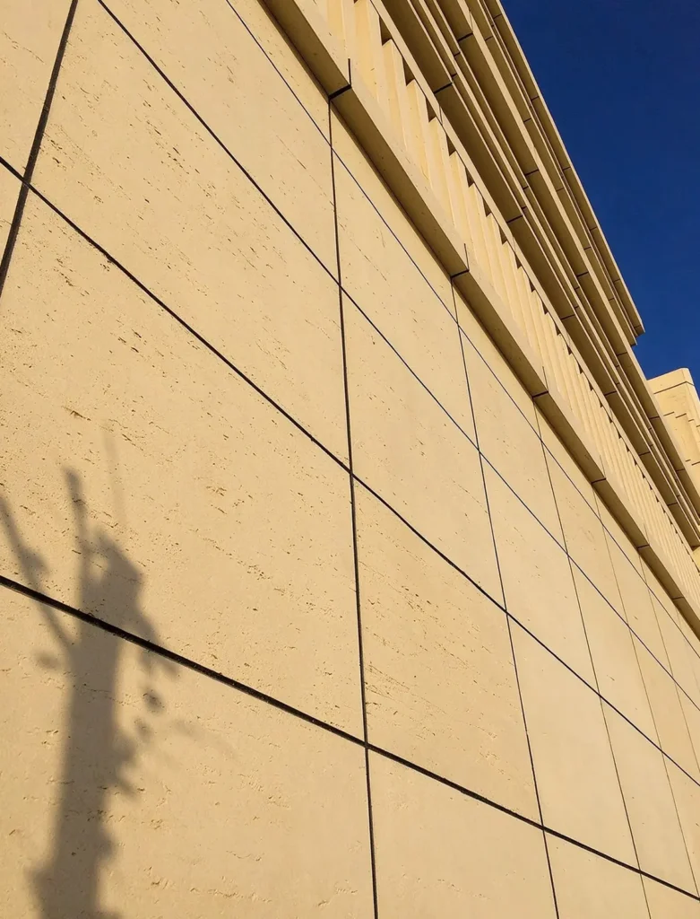 MCM flexible stone veneer with travertine texture for building facade, close-up view of exterior cladding of Xinghai No.1 in Hami, Xinjiang